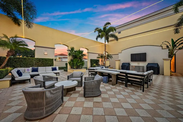 a view of a backyard with sitting area