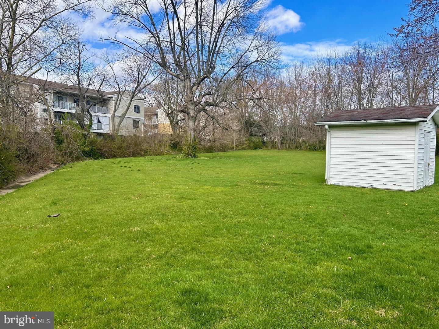1215 Milltown Road Wilmington, DE 19808 - Photo 16 of 21 a view of a backyard with large trees