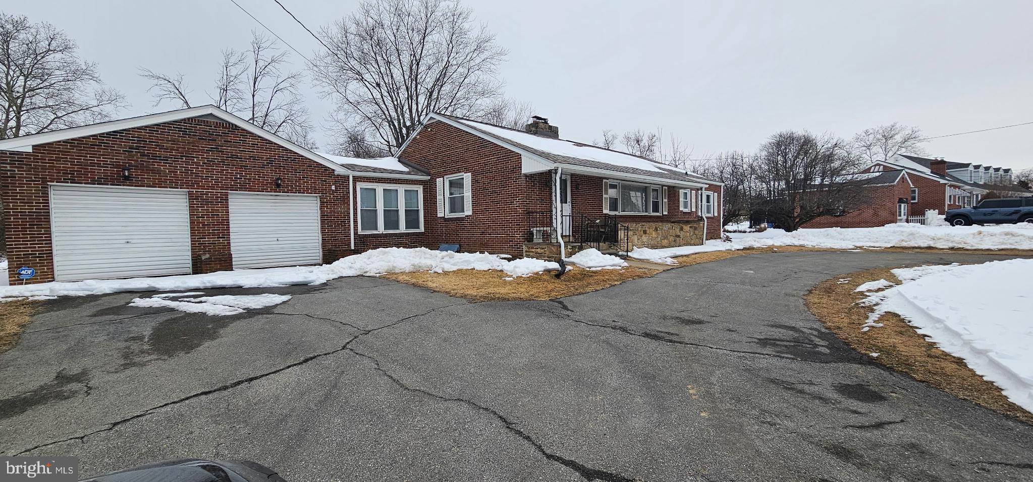 1215 Milltown Road Wilmington, DE 19808 - Photo 17 of 21 a front view of a house with a yard