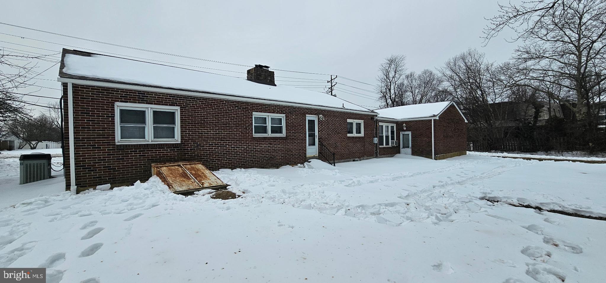 1215 Milltown Road Wilmington, DE 19808 - Photo 18 of 21 a front view of a house with a yard and garage