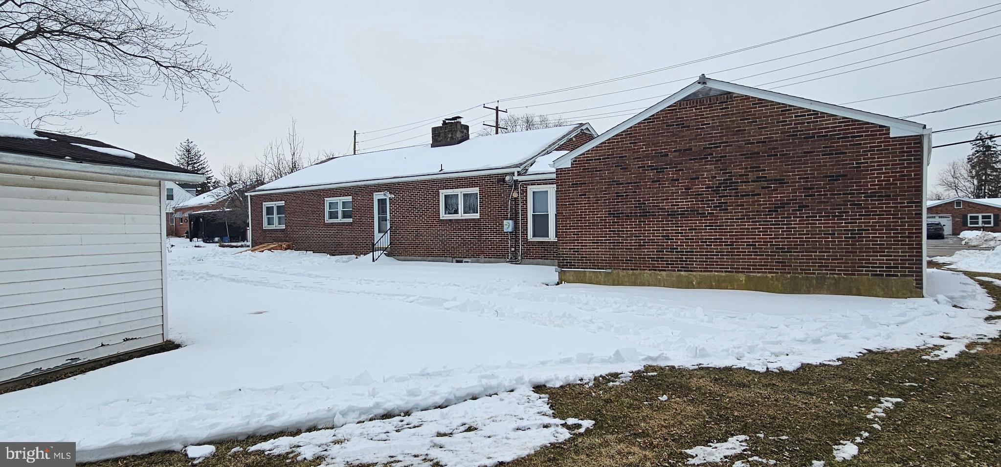 1215 Milltown Road Wilmington, DE 19808 - Photo 19 of 21 a front view of a house with a yard