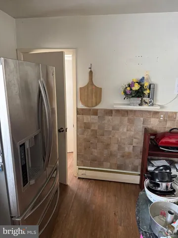 a view of a backyard with large trees