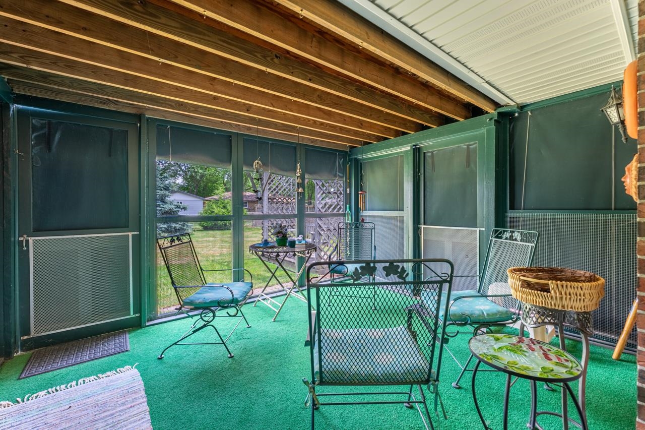 438 Rebecca Road Belvidere, IL 61008 - Photo 12 of 28 a patio with a yard table and chairs