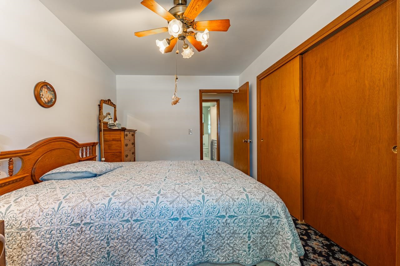 438 Rebecca Road Belvidere, IL 61008 - Photo 14 of 28 a bedroom with a bed and a window