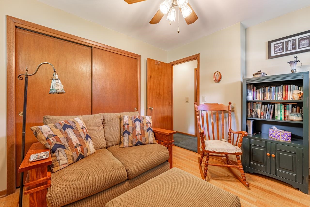 438 Rebecca Road Belvidere, IL 61008 - Photo 16 of 28 a living room with furniture cabinets and a flat screen tv