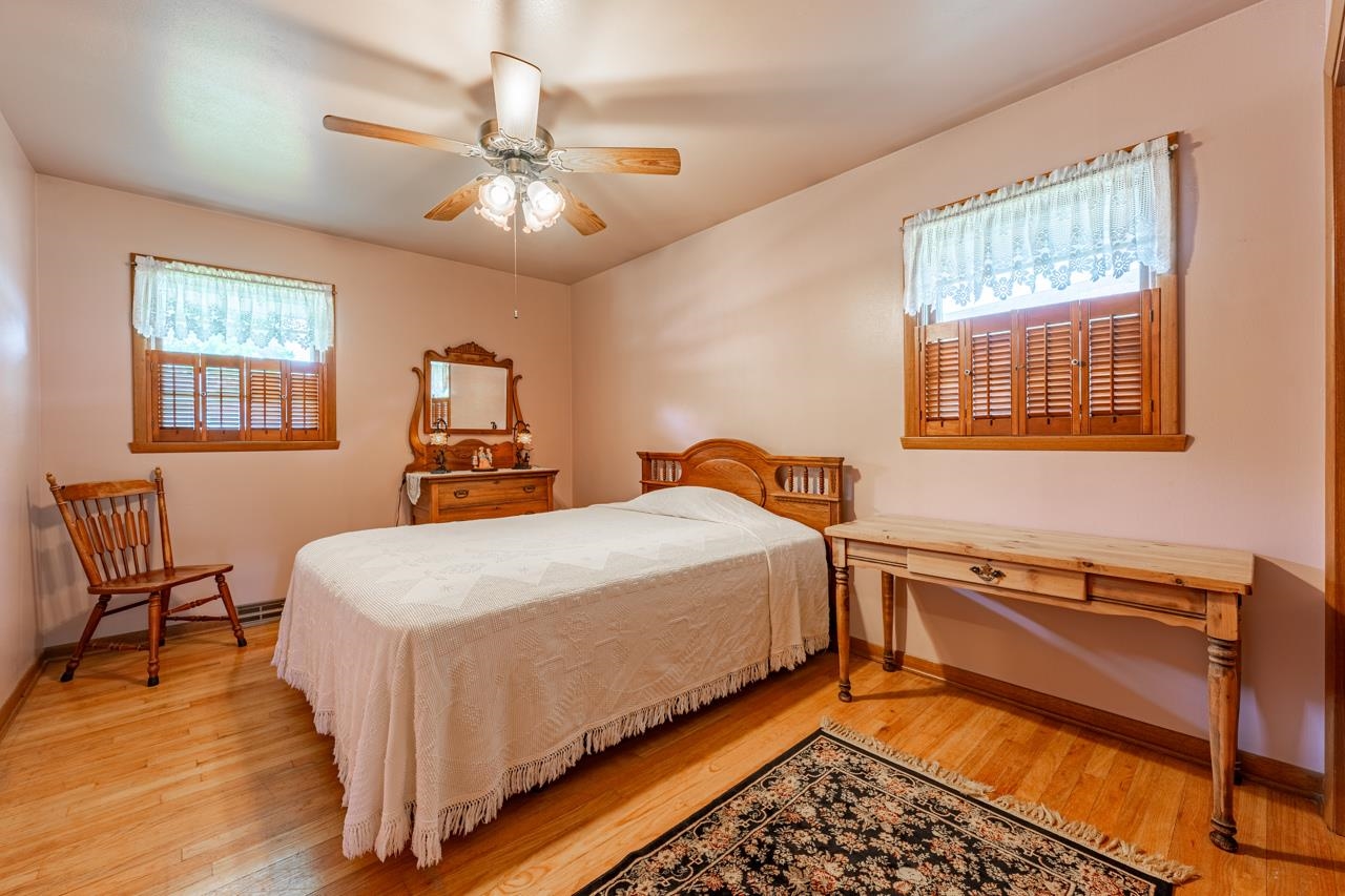 438 Rebecca Road Belvidere, IL 61008 - Photo 17 of 28 a bedroom with a bed and wooden floor