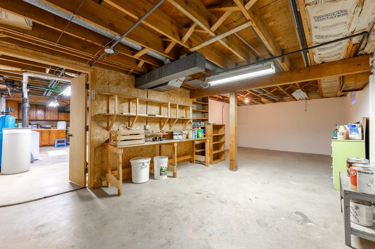 438 Rebecca Road Belvidere, IL 61008 - Photo 25 of 28 a view of a room with wooden walls