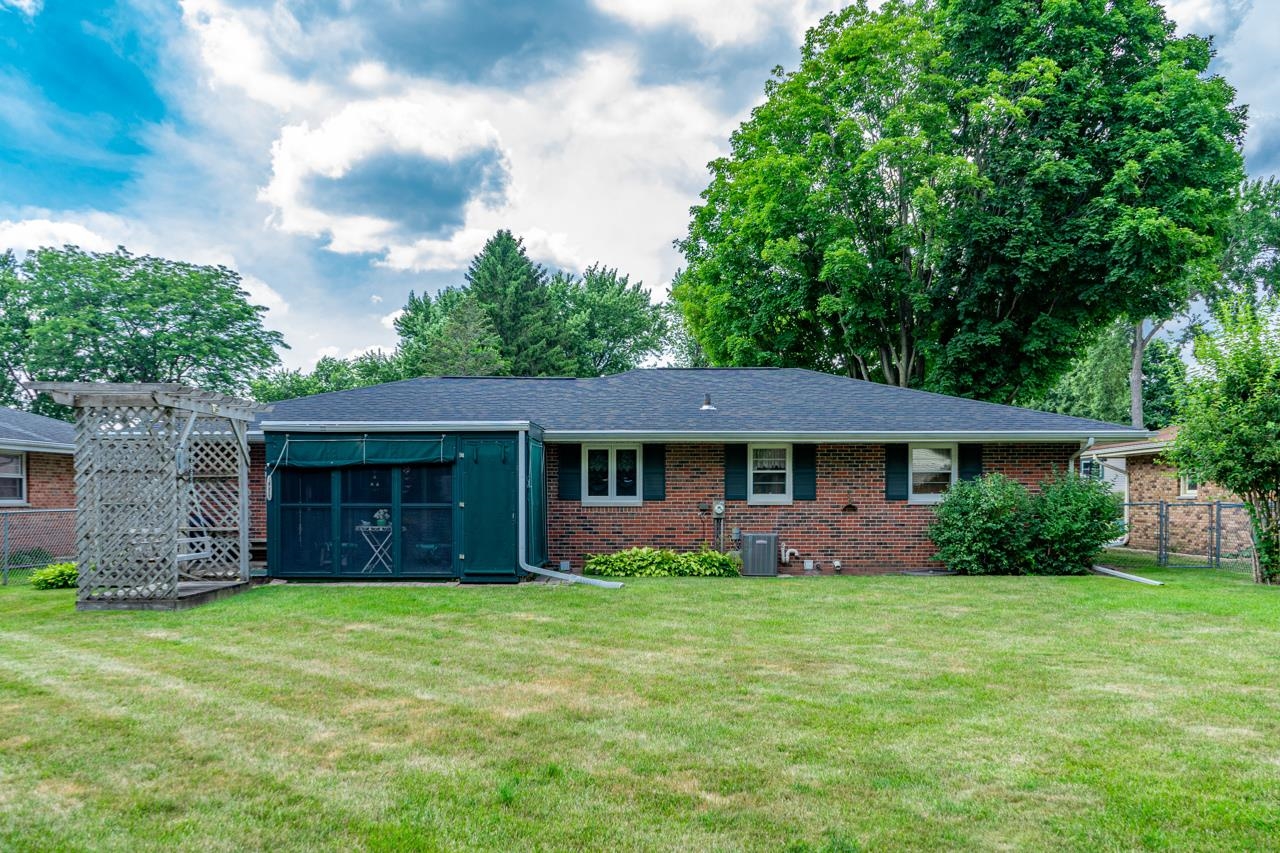 438 Rebecca Road Belvidere, IL 61008 - Photo 26 of 28 a front view of house with yard and green space