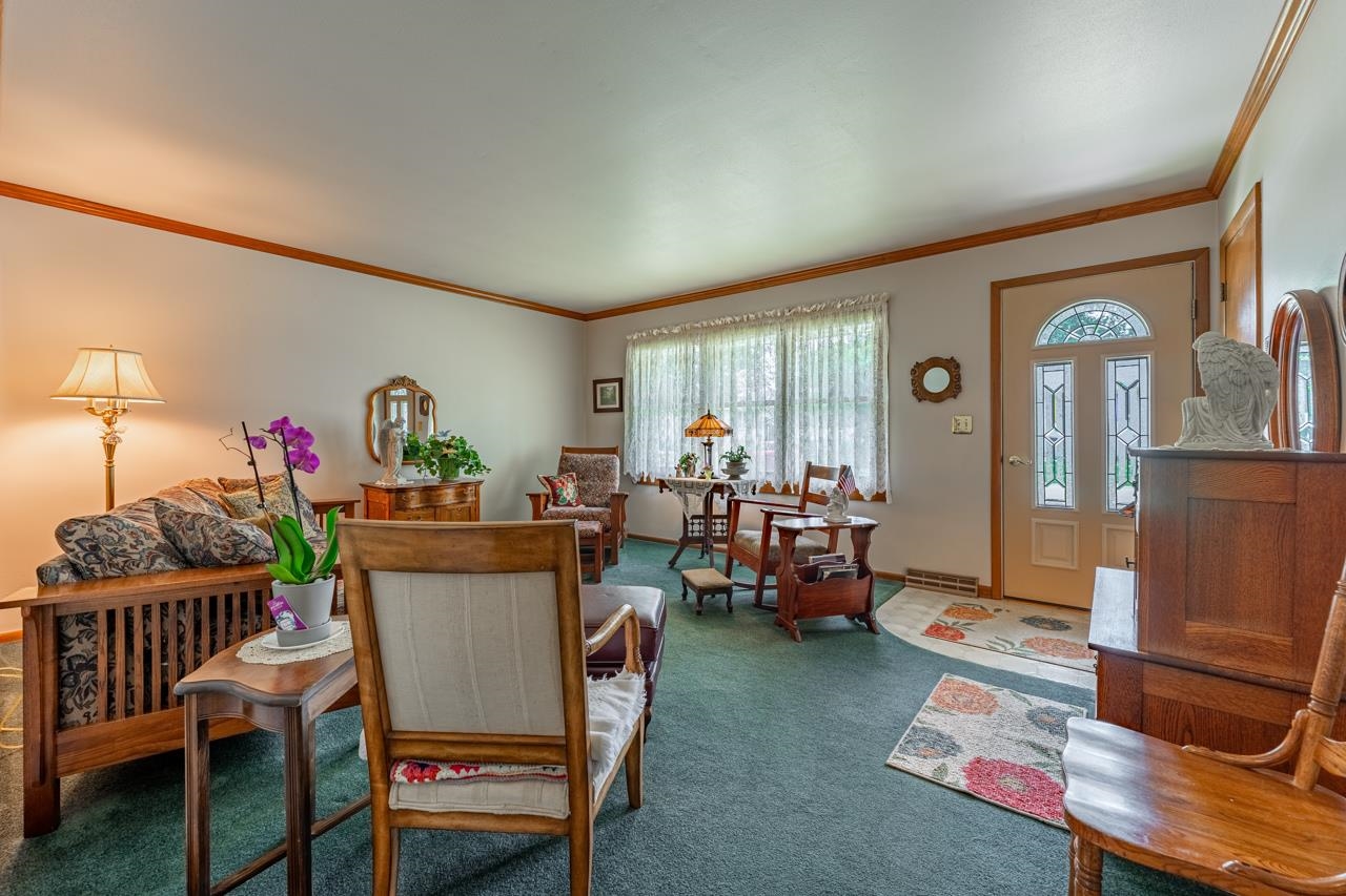 438 Rebecca Road Belvidere, IL 61008 - Photo 7 of 28 a view of a dining room with furniture window and wooden floor