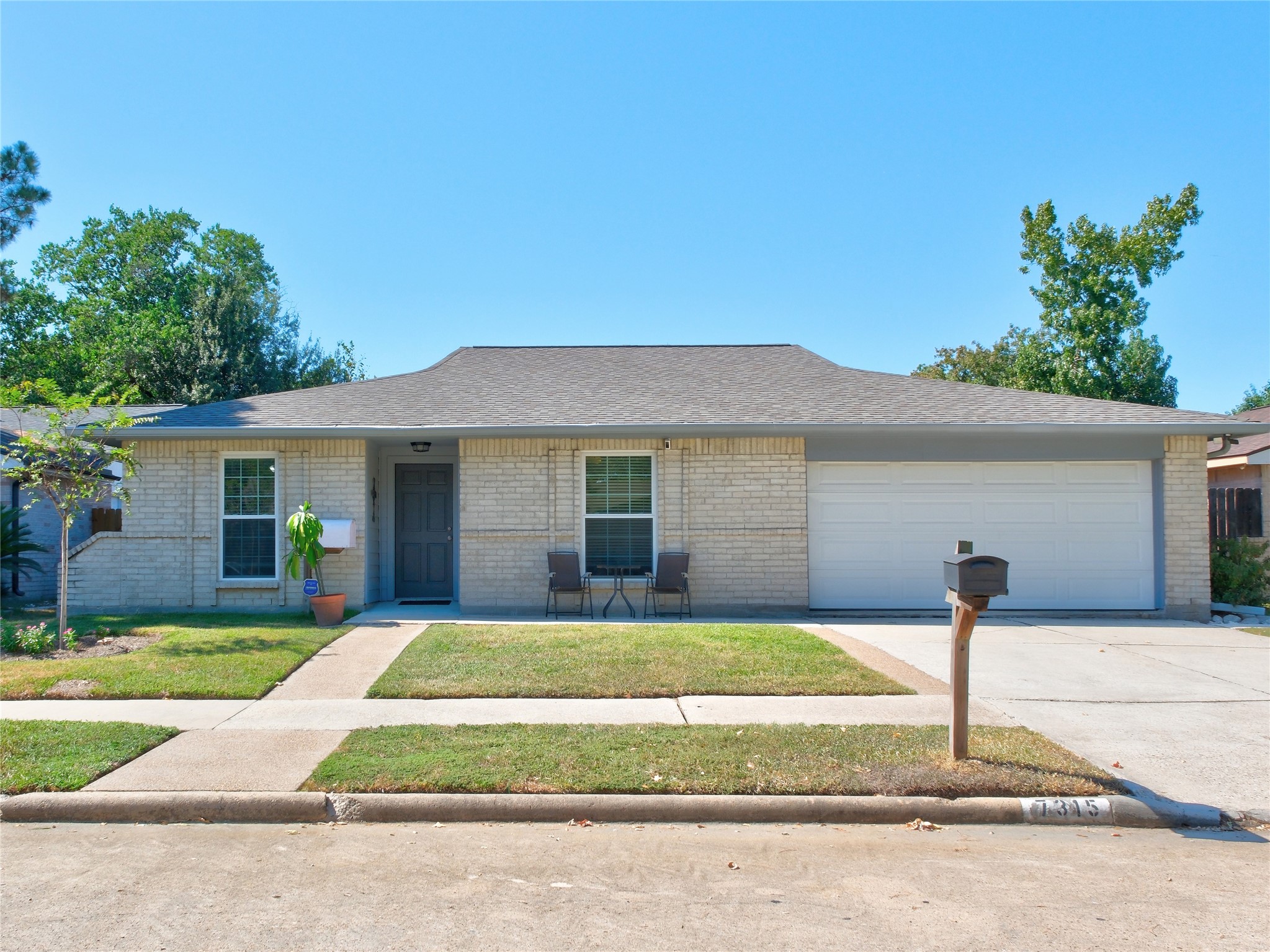 7315 Weatherhill Lane Houston, TX 77041 - Photo 1 of 40 Welcome Home! This single-story brick home with a two-car garage features a neat front yard and a welcoming sitting area. Ideal for those seeking a low-maintenance property in a quiet neighborhood.