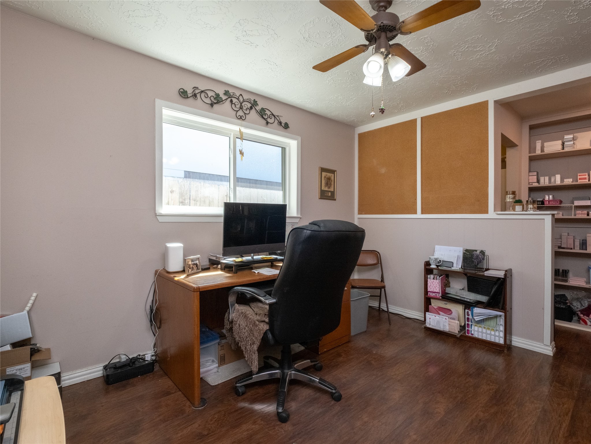 7315 Weatherhill Lane Houston, TX 77041 - Photo 20 of 40 This bedroom is brightened by a window and ceiling fan, offering space for either an office or bed.