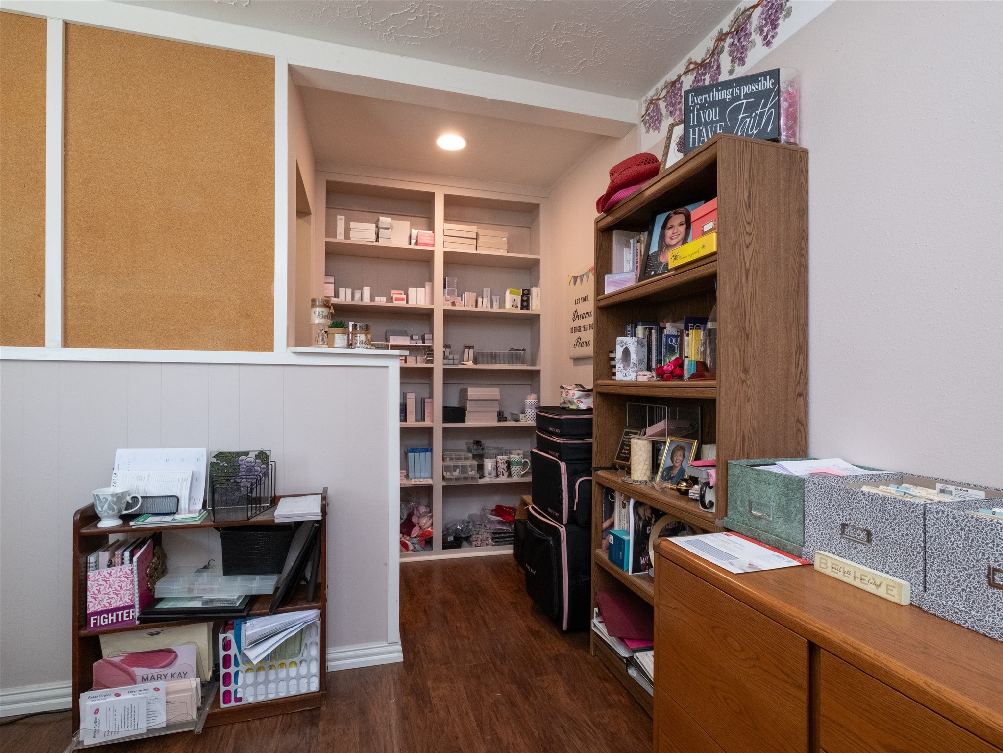 7315 Weatherhill Lane Houston, TX 77041 - Photo 21 of 40 This cozy room features a built-in shelving unit perfect for storage. The wood laminate flooring adds warmth, while the light walls to create an inviting atmosphere. Ideal for a home office or craft room.