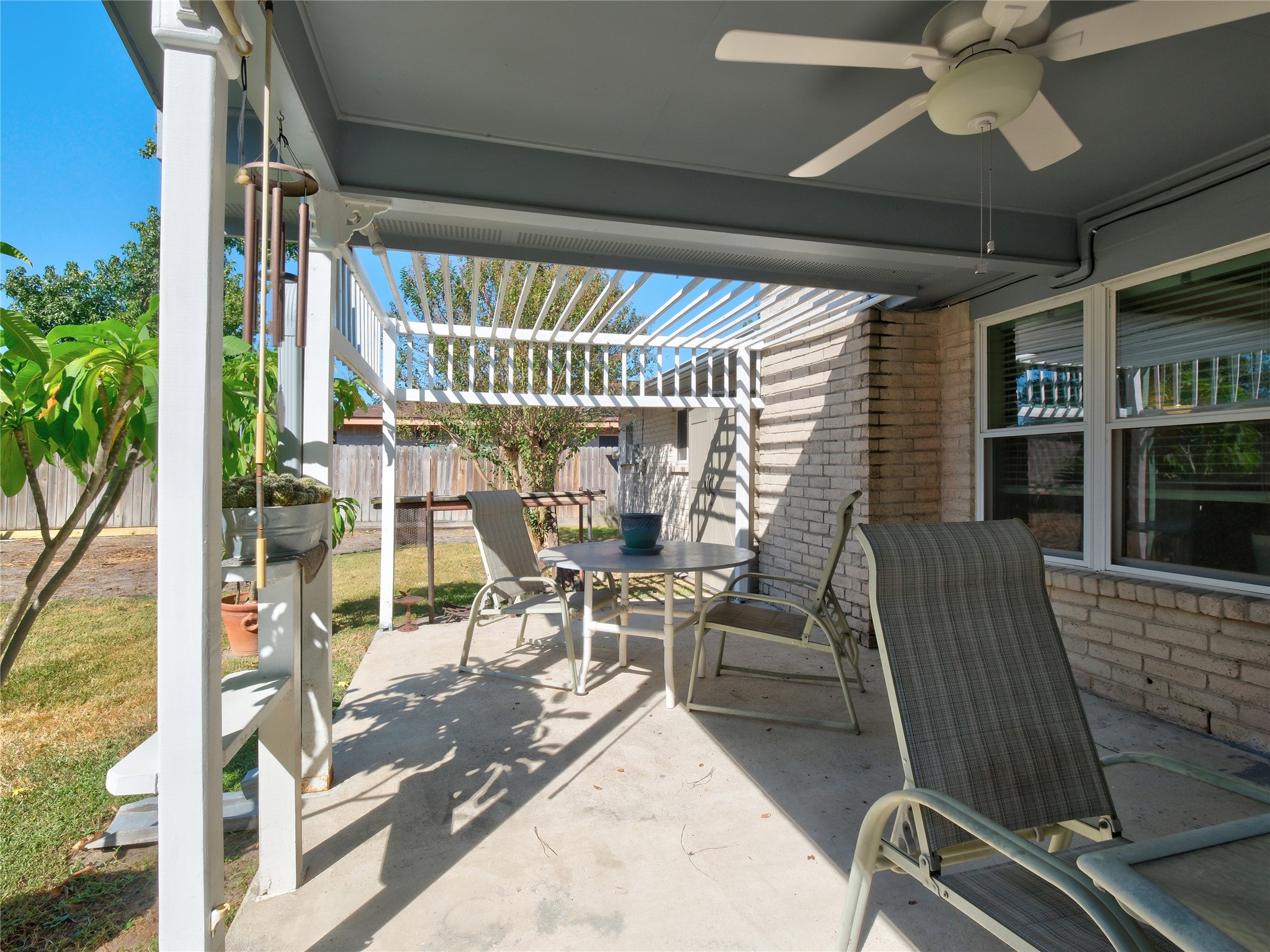 7315 Weatherhill Lane Houston, TX 77041 - Photo 34 of 40 This photo showcases a cozy covered patio perfect for outdoor relaxation. It features a fenced yard, ideal for enjoying the outdoors.