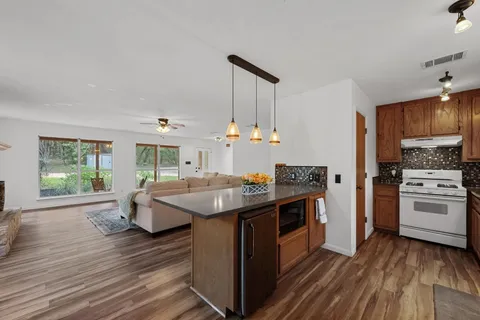 a kitchen with a stove and a sink