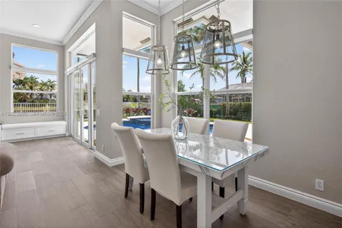 a dining room with furniture and window