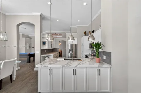 a kitchen with cabinets and outdoor seating
