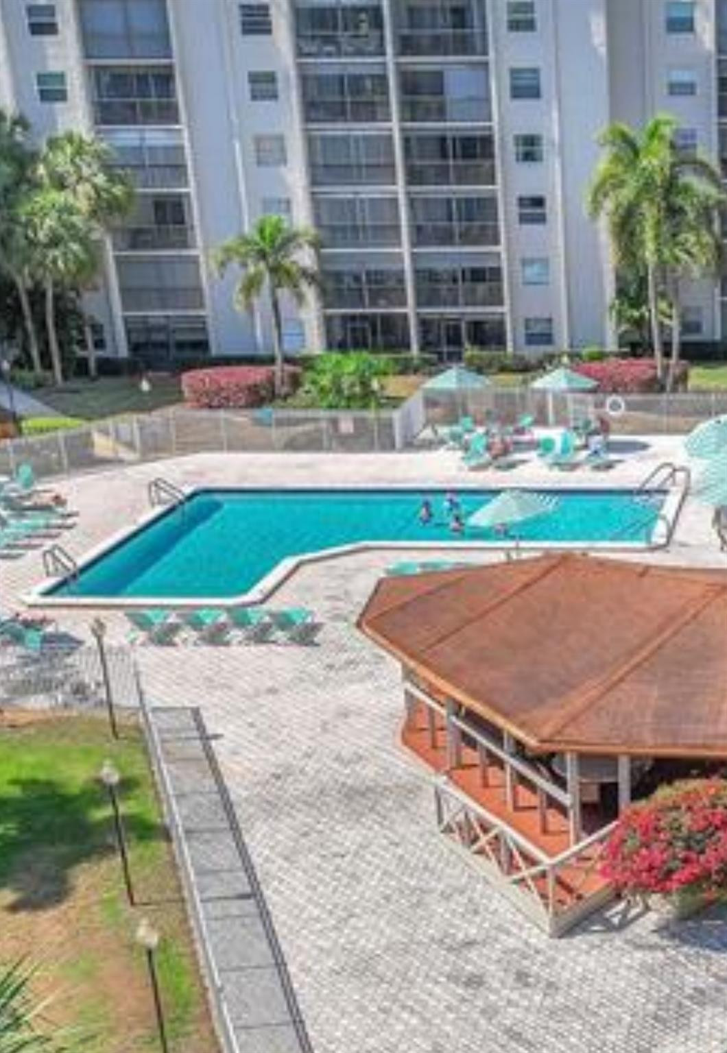 3910 Inverrary Boulevard, Unit 202B Fort Lauderdale, FL 33319 - Photo 16 of 18 Pool and covered patio area