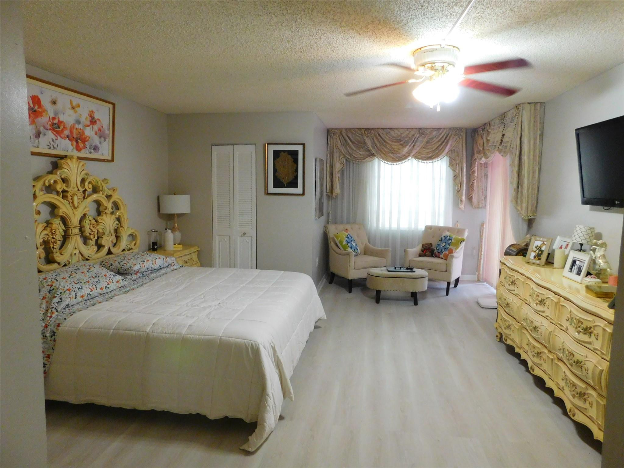 3910 Inverrary Boulevard, Unit 202B Fort Lauderdale, FL 33319 - Photo 9 of 18 Master bedroom with sitting area