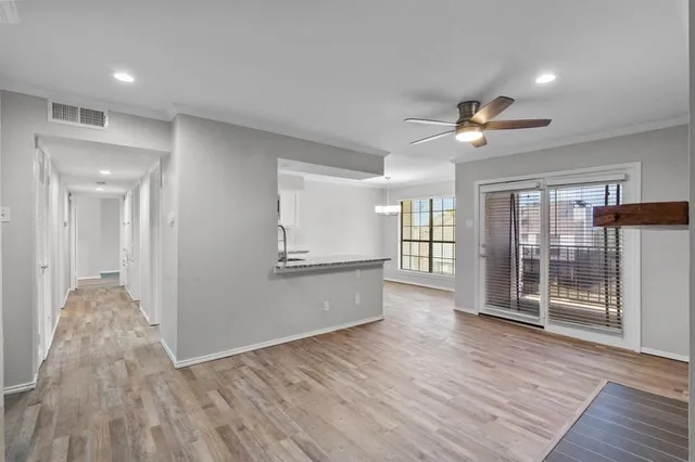 a view of livingroom with hardwood floor and a ceiling fan