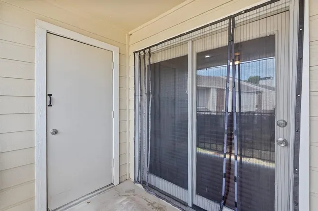 a bathroom with a glass shower door