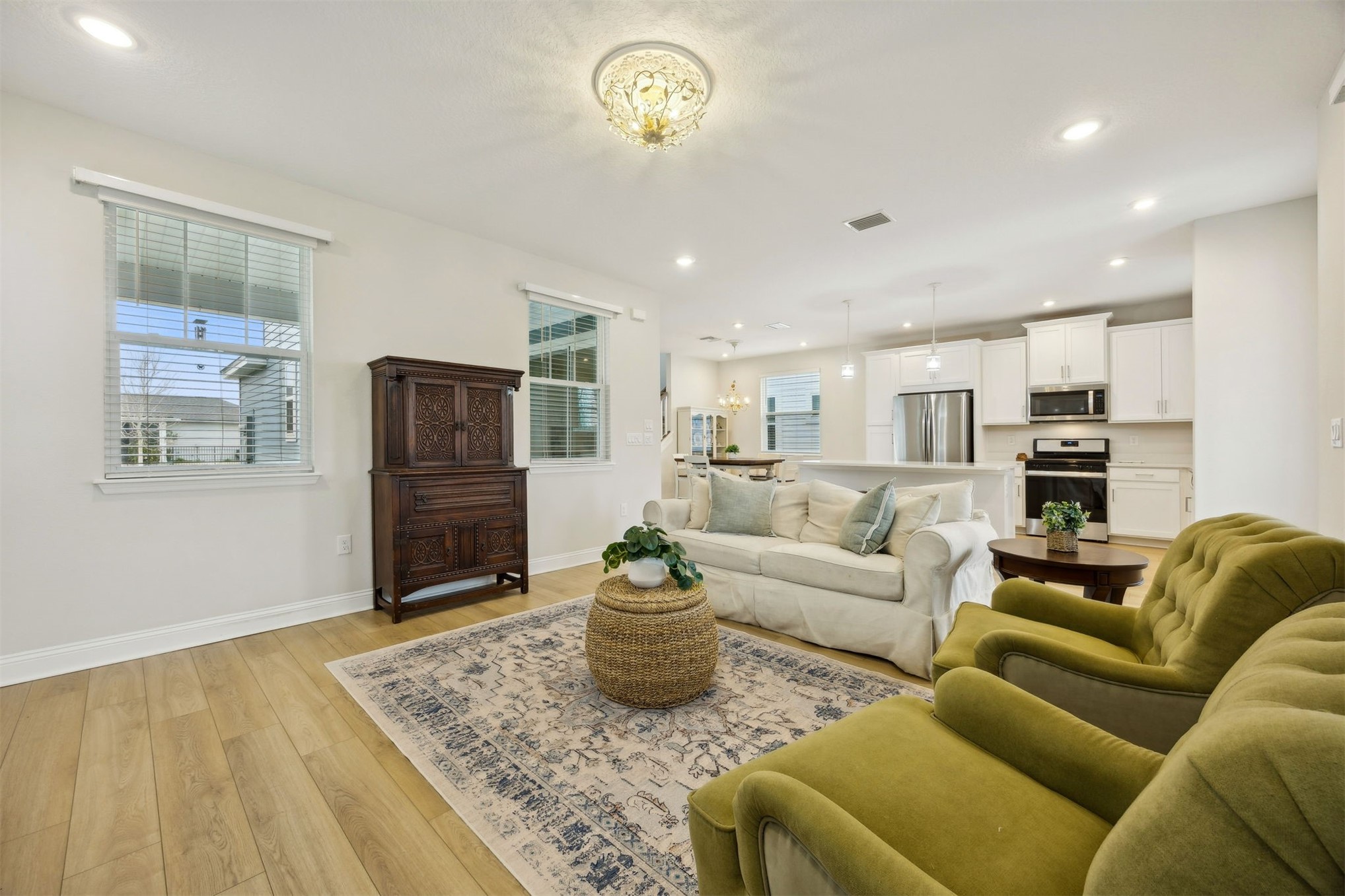 141 Redbud Lane Yulee, FL 32097 - Photo 12 of 61 a living room with furniture a refrigerator and a table