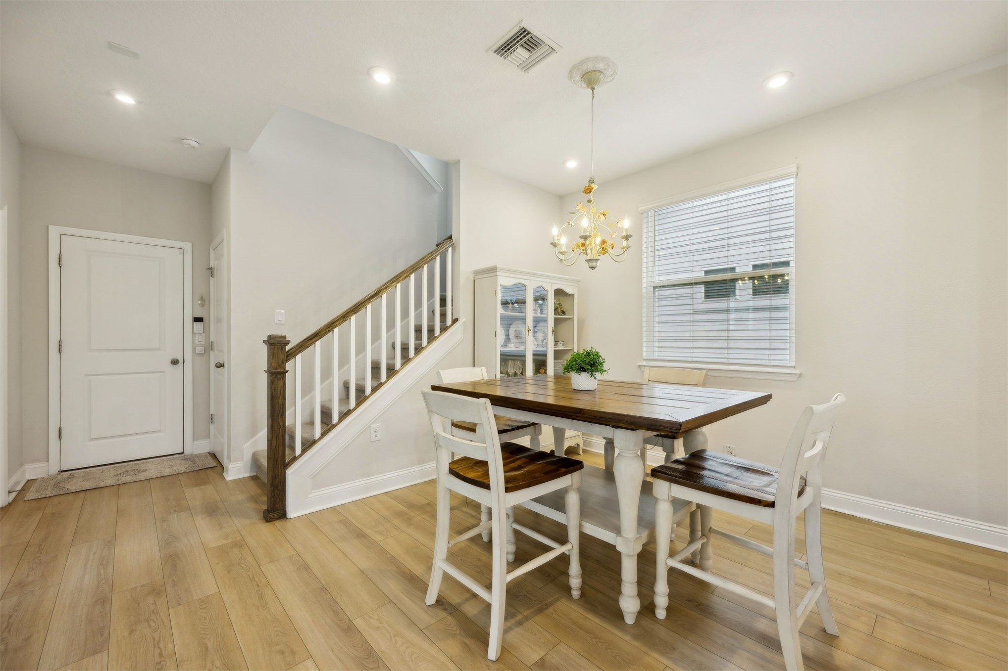 141 Redbud Lane Yulee, FL 32097 - Photo 23 of 61 a view of a dining room with furniture and wooden floor