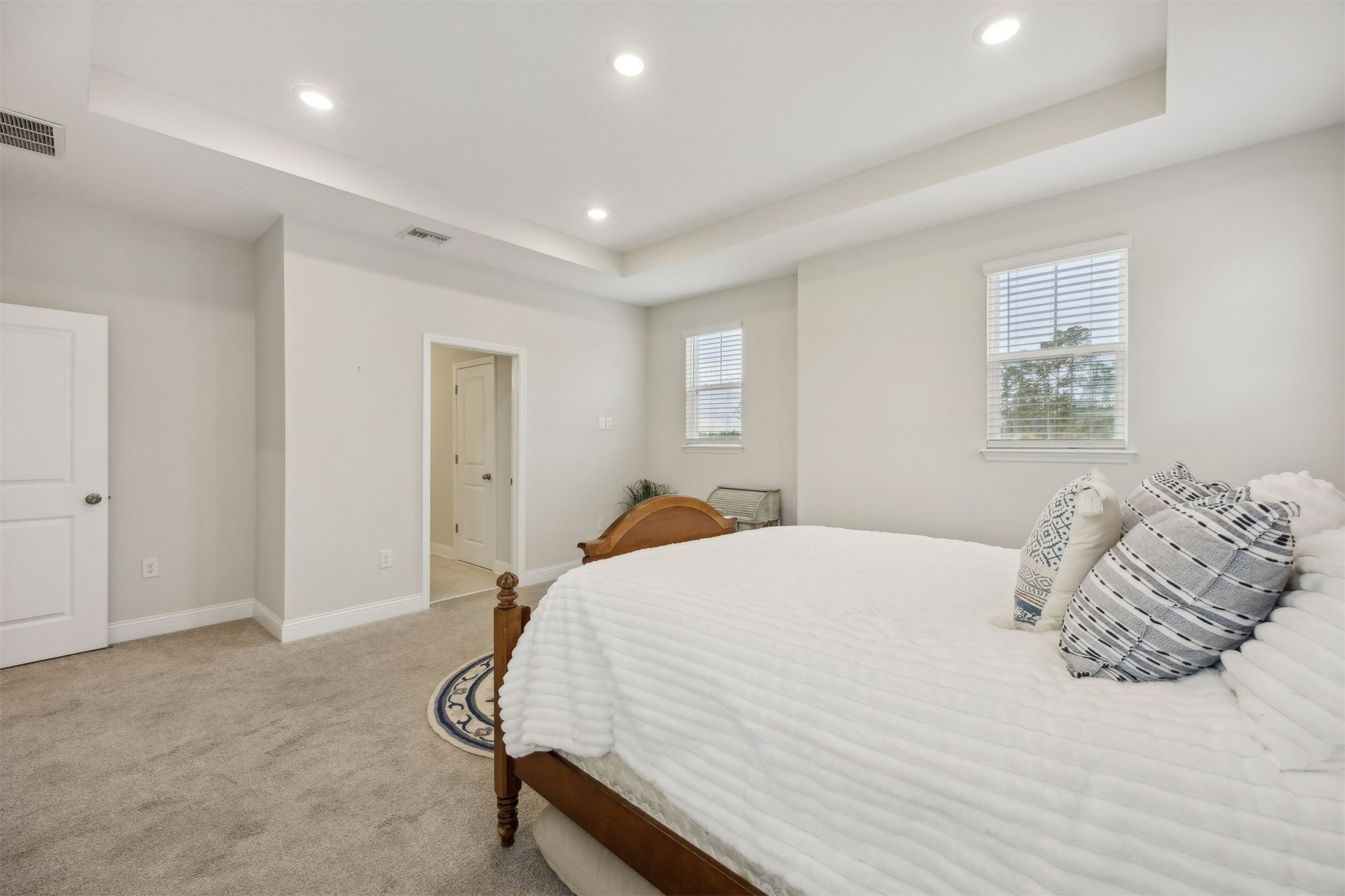 141 Redbud Lane Yulee, FL 32097 - Photo 29 of 61 a bedroom with a bed and a dresser