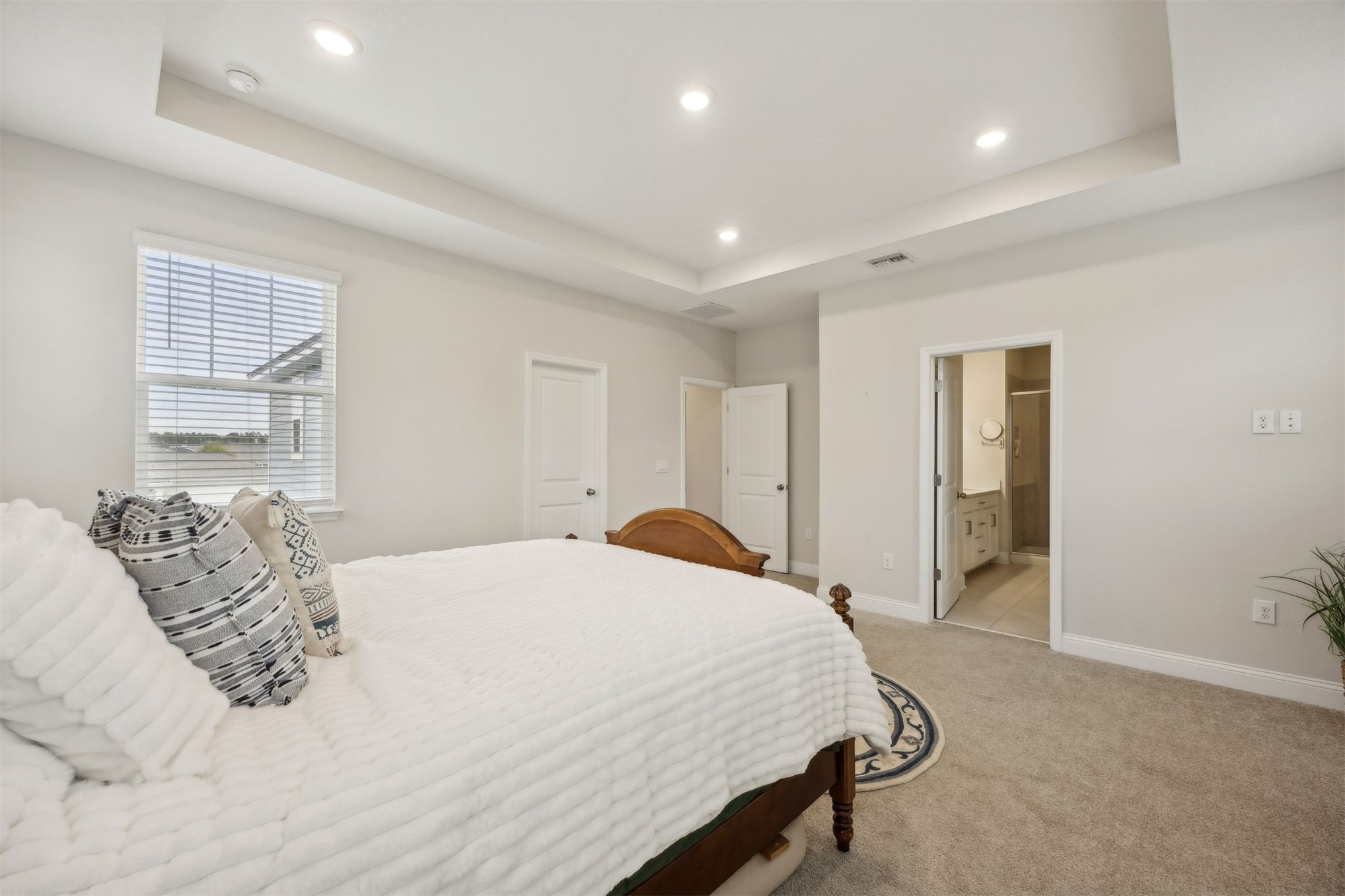 141 Redbud Lane Yulee, FL 32097 - Photo 30 of 61 a spacious bedroom with a bed and a dresser