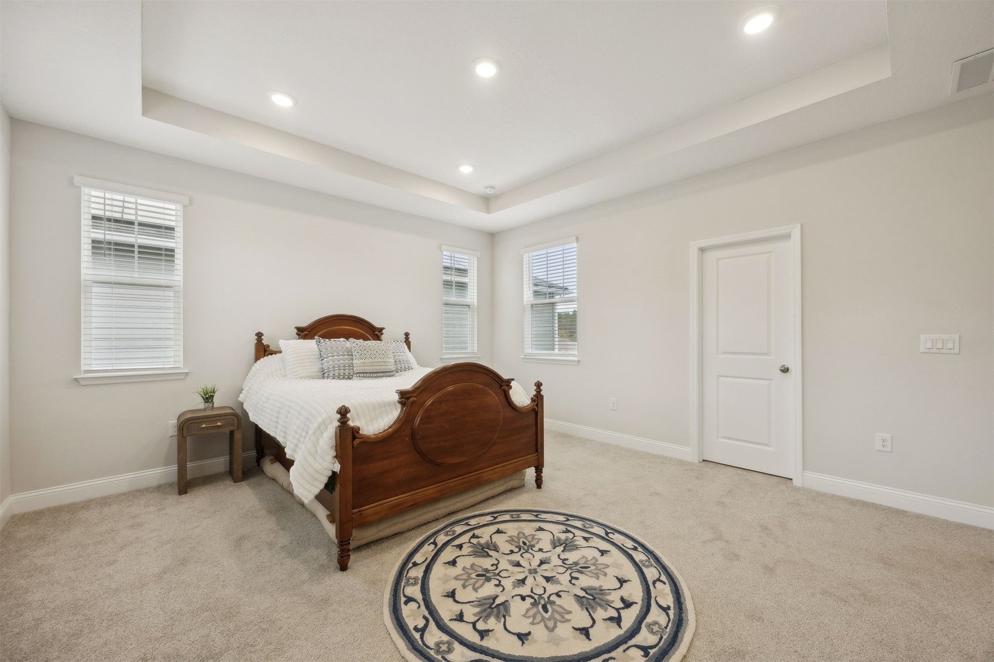 141 Redbud Lane Yulee, FL 32097 - Photo 31 of 61 a bedroom with a bed and a chair