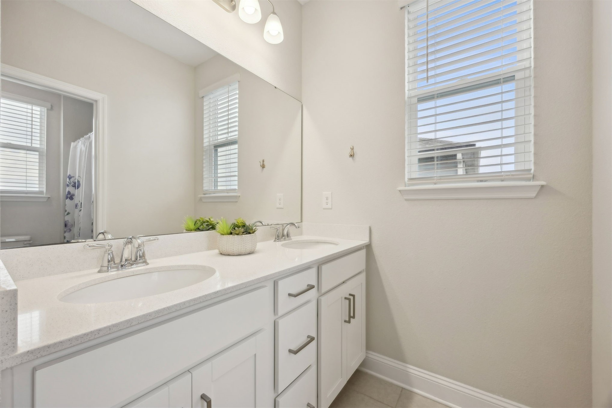 141 Redbud Lane Yulee, FL 32097 - Photo 37 of 61 a bathroom with a sink and a mirror