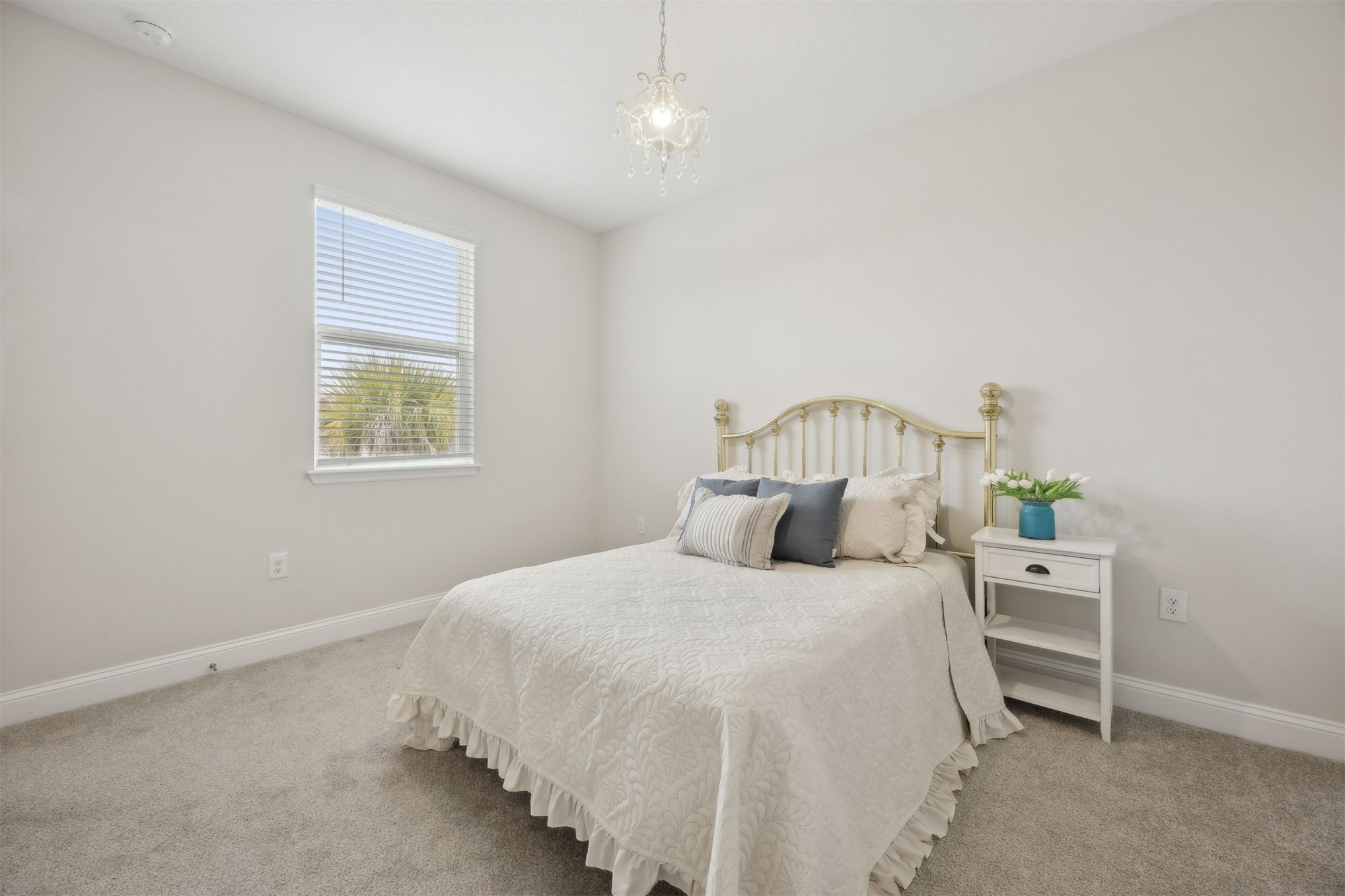 141 Redbud Lane Yulee, FL 32097 - Photo 40 of 61 a bedroom with a bed and a window