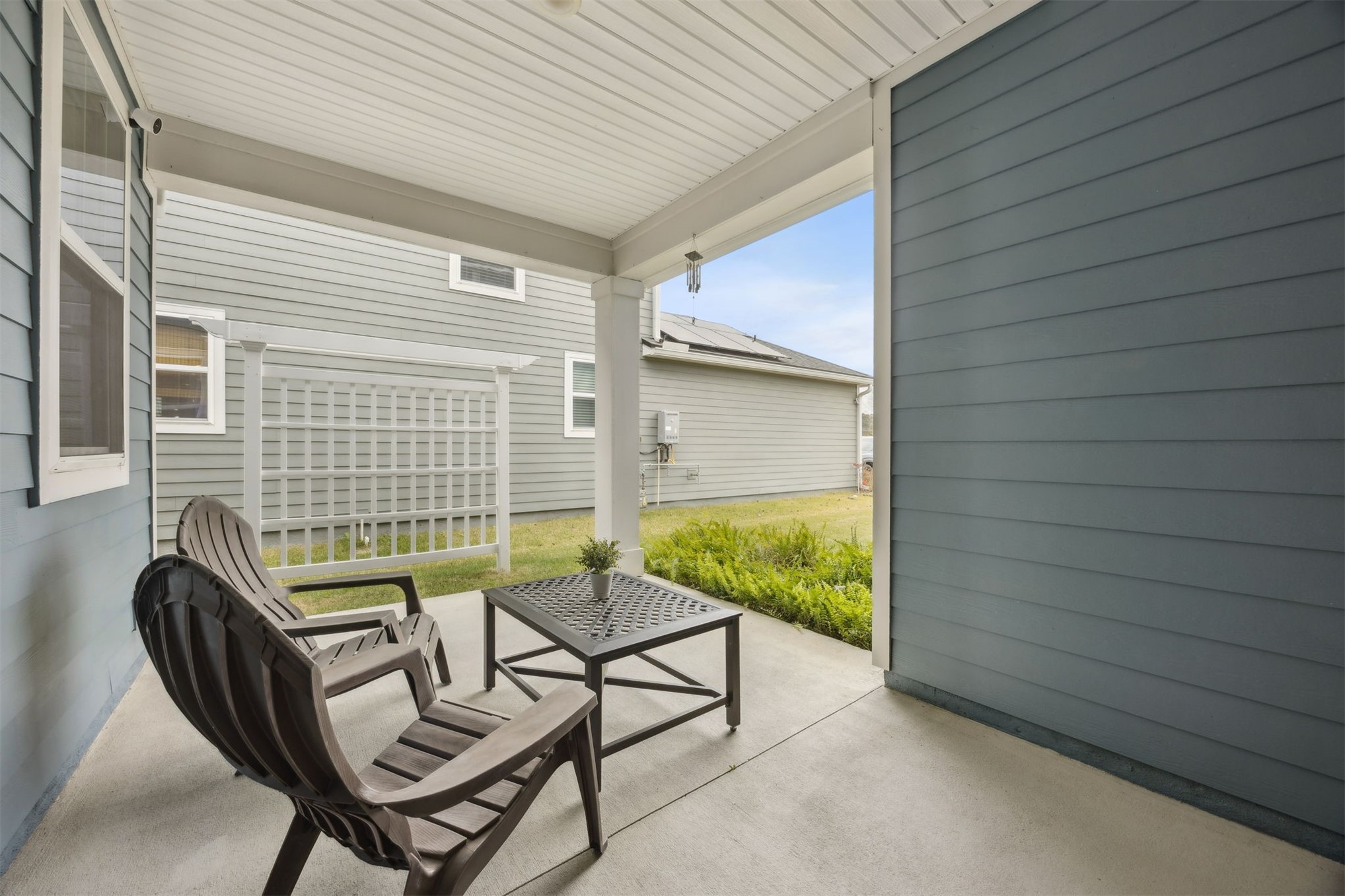 141 Redbud Lane Yulee, FL 32097 - Photo 45 of 61 a balcony with furniture and a gate