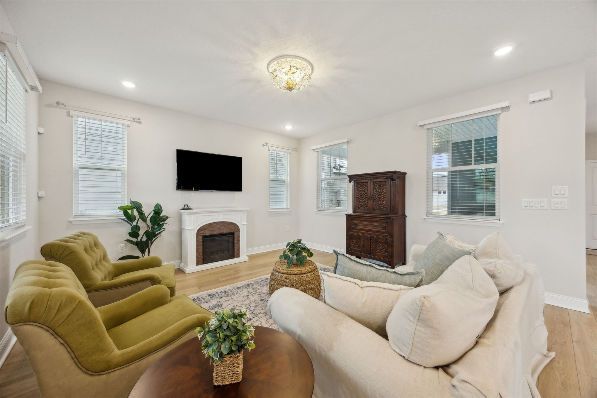 141 Redbud Lane Yulee, FL 32097 - Photo 9 of 61 a living room with furniture a fireplace and a flat screen tv