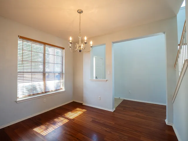 a living room with stainless steel appliances kitchen island granite countertop furniture and a view of kitchen