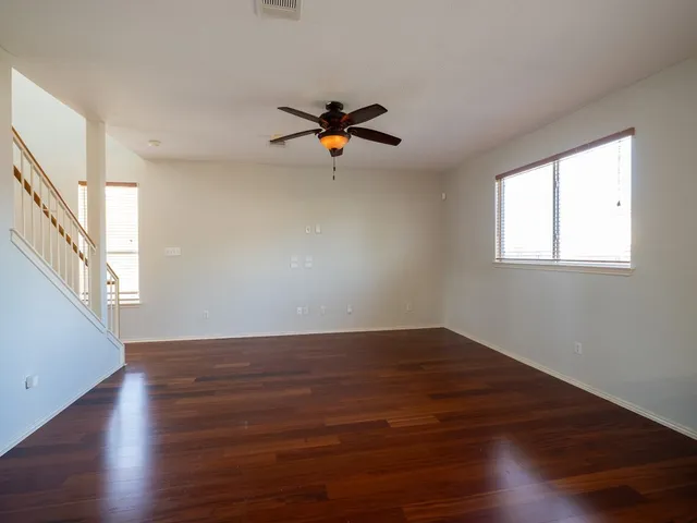 a view of a big yard with a large tree