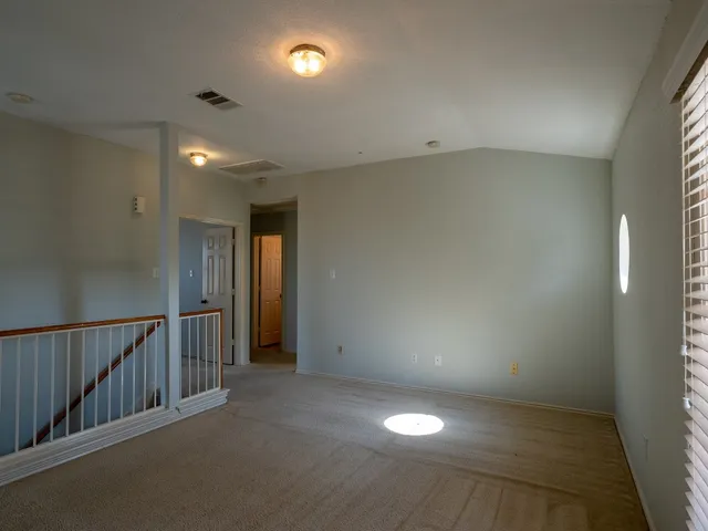a view of a balcony with wooden floor