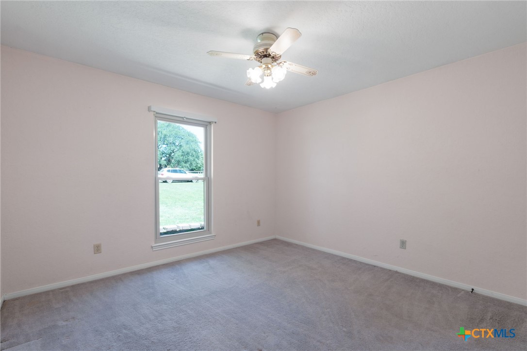 3391 Lois Lane Kempner, TX 76539 - Photo 20 of 35 an empty room with a window and a ceiling fan