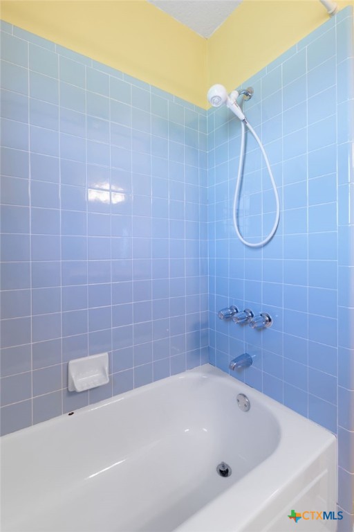 3391 Lois Lane Kempner, TX 76539 - Photo 23 of 35 a bathroom with a white bath tub and a shower