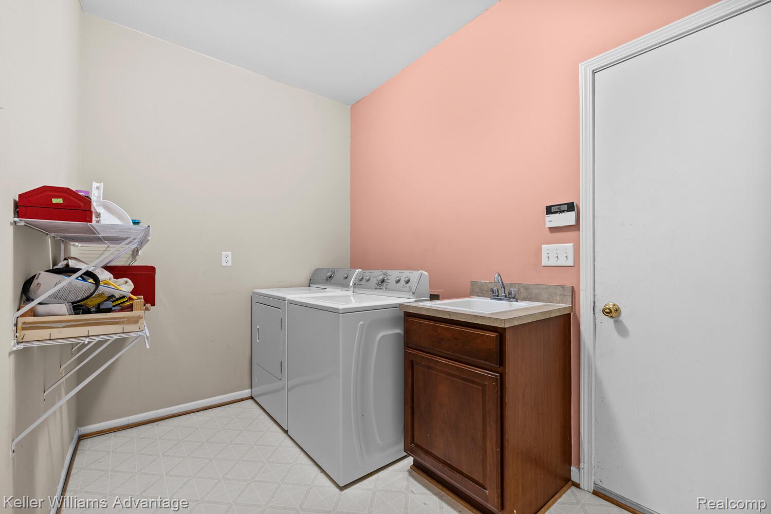 4100 Norwich Court Rochester, MI 48306 - Photo 27 of 72 Laundry room with light flooring and separate washer and dryer