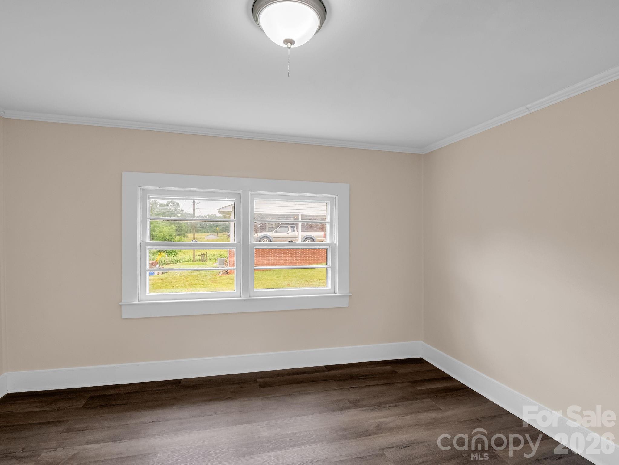 170 Dobbins Road Ellenboro, NC 28040 - Photo 29 of 32 a view of an empty room with wooden floor and a window
