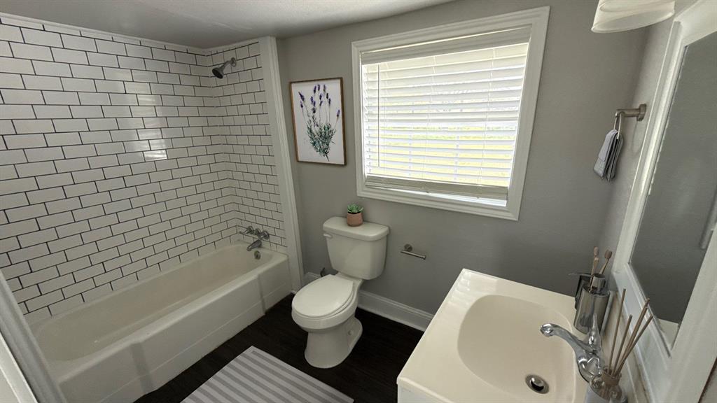 1338 State Highway 121 Bonham, TX 75418 - Photo 30 of 32 a bathroom with a sink a toilet and shower