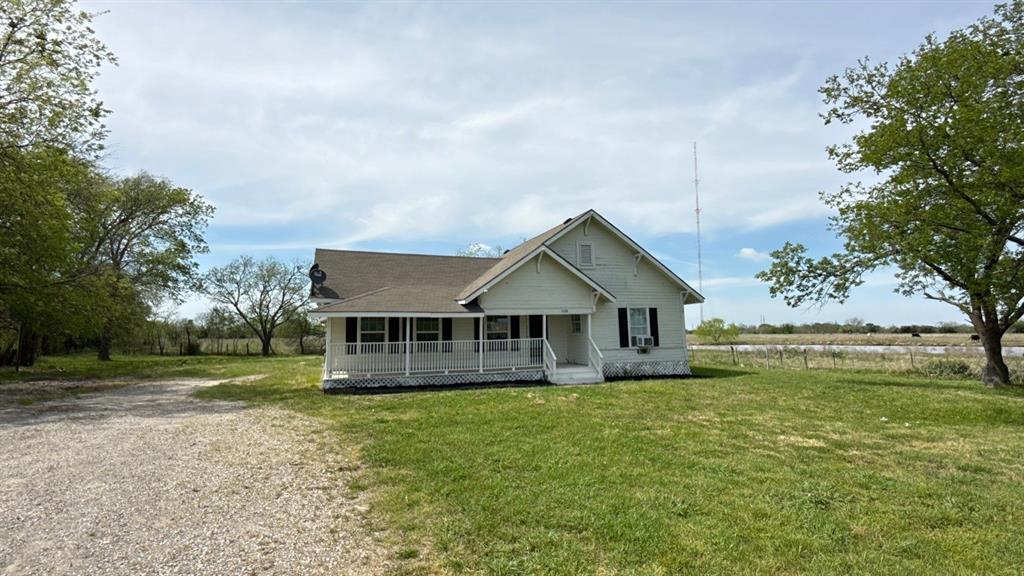 1338 State Highway 121 Bonham, TX 75418 - Photo 25 of 32 a view of a house next to a big yard with large trees