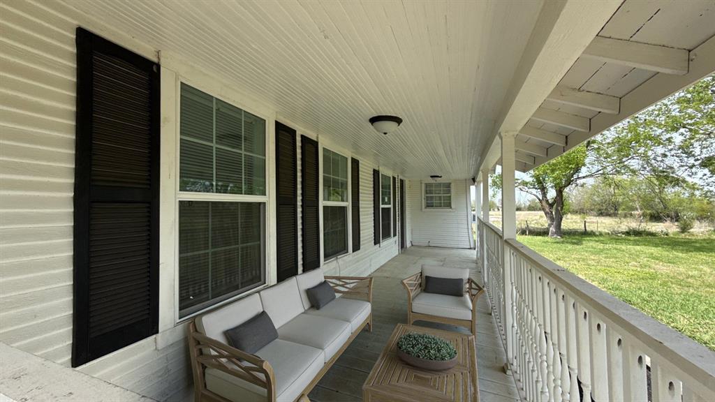 1338 State Highway 121 Bonham, TX 75418 - Photo 26 of 32 a balcony with couch and outdoor view