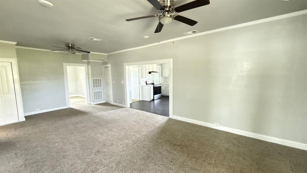1338 State Highway 121 Bonham, TX 75418 - Photo 8 of 32 a view of a big room with wooden floor and windows