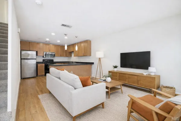 a living room with furniture and a flat screen tv