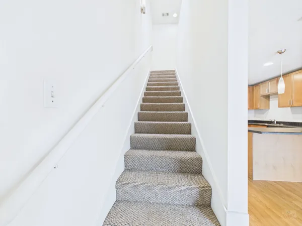 a view of a hallway with staircase