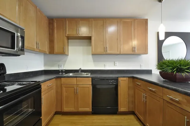 a kitchen with a sink and cabinets
