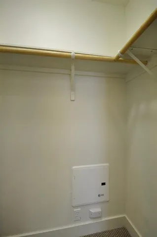 a bathroom with a granite countertop sink a mirror and a bathtub