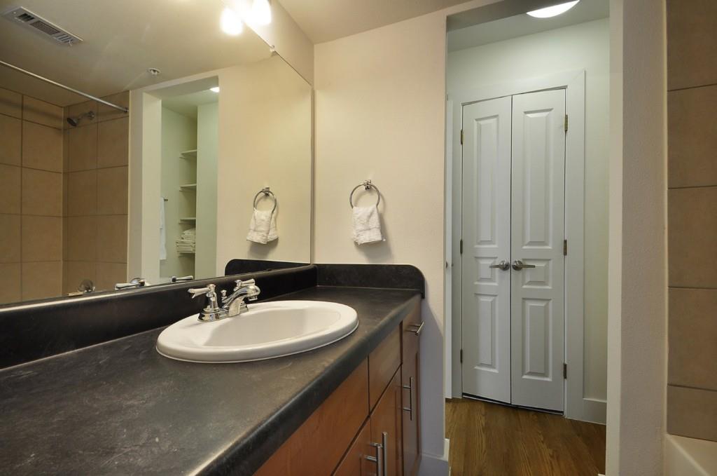 711 West 32nd Street, Unit 108 Austin, TX 78705 - Photo 23 of 28 a bathroom with a sink and a mirror
