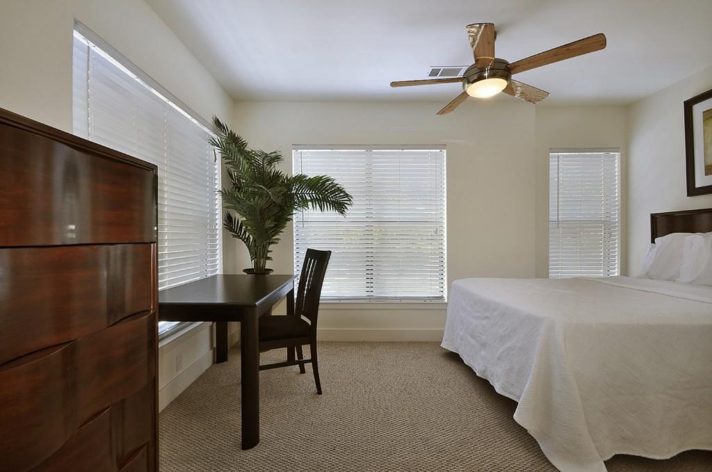 711 West 32nd Street, Unit 108 Austin, TX 78705 - Photo 24 of 28 a bedroom with a bed and a window